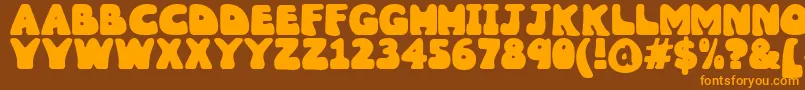 Czcionka Wobbles1 – pomarańczowe czcionki na brązowym tle