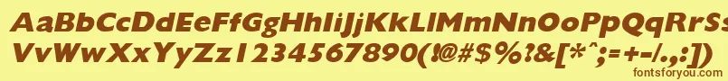 フォントGiliganextraboldItalic – 茶色の文字が黄色の背景にあります。