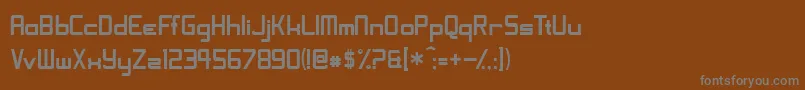 フォントShoomverticalNormal – 茶色の背景に灰色の文字