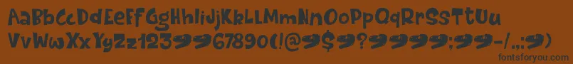 DinosaurCakeDemo Font – Black Fonts on Brown Background