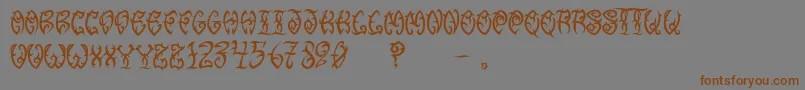 Saiba mais sobre a fonte VtcTribalthreefree Fonte VtcTribalthreefree – fontes marrons em um fundo cinza