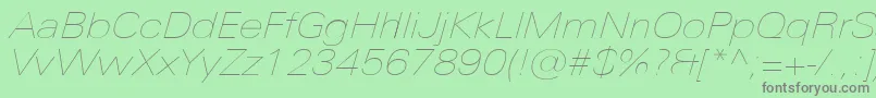 UniversNextProUltralightExtendedItalic Font – Gray Fonts on Green Background