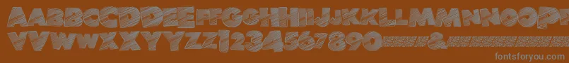 Banlieuedisco-Schriftart – Graue Schriften auf braunem Hintergrund