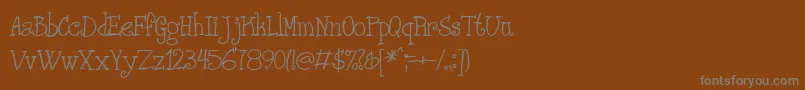 Phanrg ffy Font – Gray Fonts on Brown Background