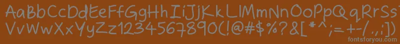 Zakirahshand Font – Gray Fonts on Brown Background