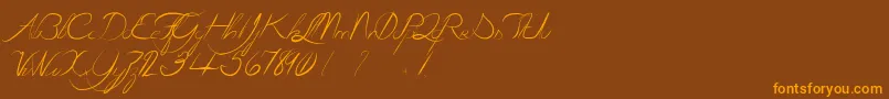 LaGrenouilleVerteQuiDevientTouteRouge-Schriftart – Orangefarbene Schriften auf braunem Hintergrund