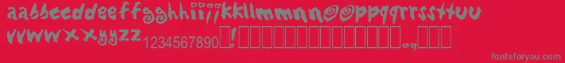 LovingBabes-Schriftart – Graue Schriften auf rotem Hintergrund