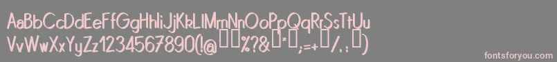 Quinrg-Schriftart – Rosa Schriften auf grauem Hintergrund