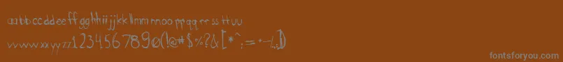 Bootyscratch-Schriftart – Graue Schriften auf braunem Hintergrund