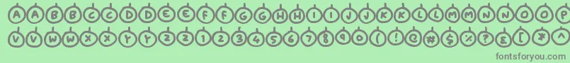 フォントBaubles – 緑の背景に灰色の文字