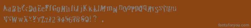 OfficerDown-fontti – harmaat kirjasimet ruskealla taustalla