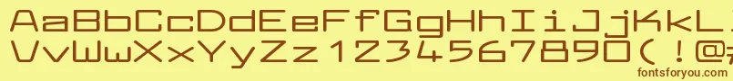 フォントLarabiefontxtBold – 茶色の文字が黄色の背景にあります。