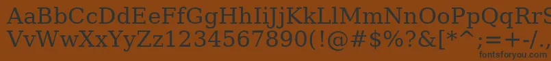 フォントAeOstorah – 黒い文字が茶色の背景にあります