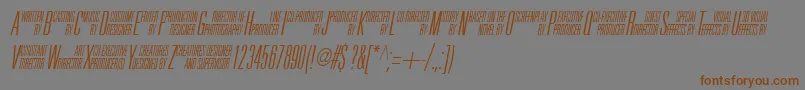 フォントUniAccItalic – 茶色の文字が灰色の背景にあります。