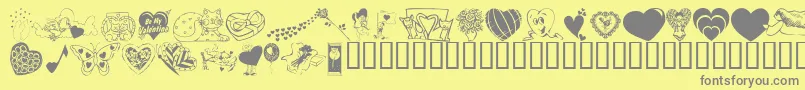KrBeMineAgain-fontti – harmaat kirjasimet keltaisella taustalla