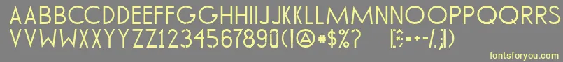 TommyHilfigerAf-fontti – keltaiset fontit harmaalla taustalla