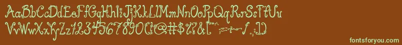 フォントAustieBostYouWearFlowersSolid – 緑色の文字が茶色の背景にあります。
