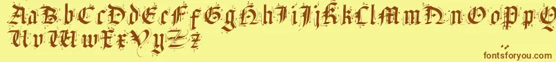 フォントSatanHumSav – 茶色の文字が黄色の背景にあります。