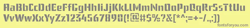 フォントUssrStencil – 黄色の背景に灰色の文字