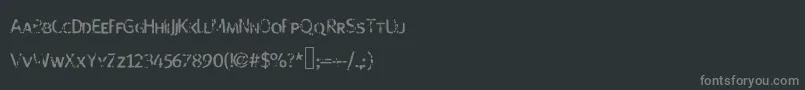 Fonte Strangeboy – fontes cinzas em um fundo preto