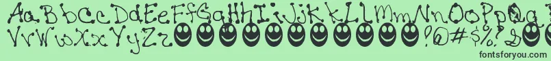 JaninesWriting Font – Black Fonts on Green Background