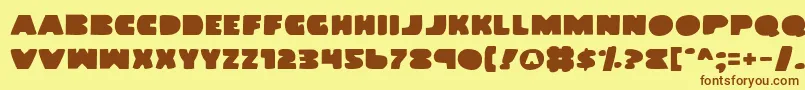 フォントLandWhale – 茶色の文字が黄色の背景にあります。