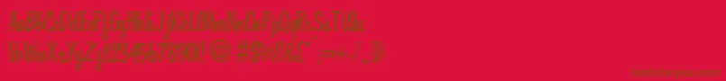 フォントHousedbNormal – 赤い背景に茶色の文字