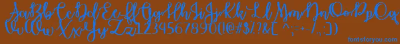 OctoberMoonTtf Font – Blue Fonts on Brown Background