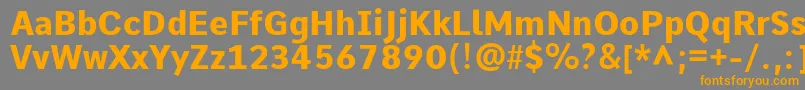 フォントCommeExtrabold – オレンジの文字は灰色の背景にあります。