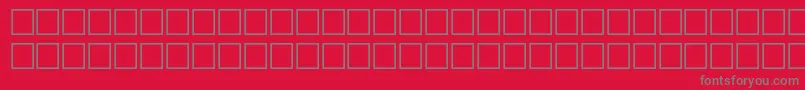 フォントTashpri – 赤い背景に灰色の文字