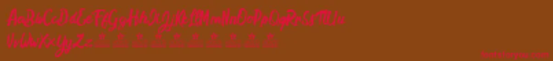 HamstersPersonalUse Font – Red Fonts on Brown Background