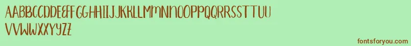 AprilsStandard Font – Brown Fonts on Green Background