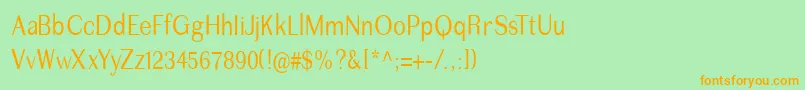 フォントImperiumcond – オレンジの文字が緑の背景にあります。