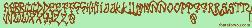 TribalFunk Font – Brown Fonts on Green Background