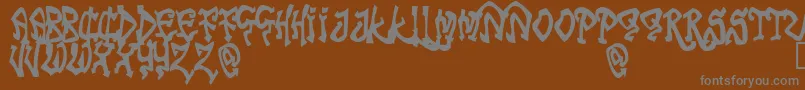 Więcej informacji o czcionce TribalFunk Czcionka TribalFunk – szare czcionki na brązowym tle