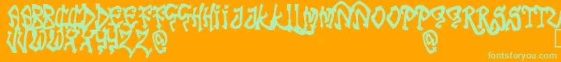 TribalFunk-Schriftart – Grüne Schriften auf orangefarbenem Hintergrund