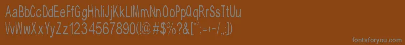 TypicalAbc-Schriftart – Graue Schriften auf braunem Hintergrund