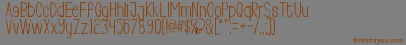 Livingfree-Schriftart – Braune Schriften auf grauem Hintergrund