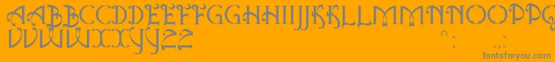 AntiqueQuestSt-Schriftart – Graue Schriften auf orangefarbenem Hintergrund