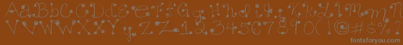 Daisy ffy Font – Gray Fonts on Brown Background