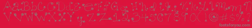 Fonte Daisy ffy – fontes cinzas em um fundo vermelho