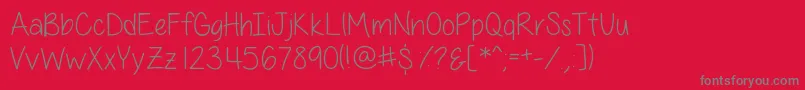 AllThingsPinkSkinny-fontti – harmaat kirjasimet punaisella taustalla