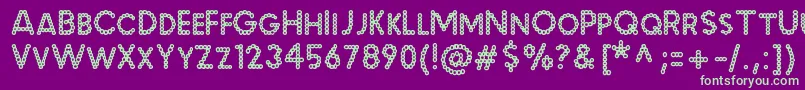 MalachecrunchRegular Font – Green Fonts on Purple Background