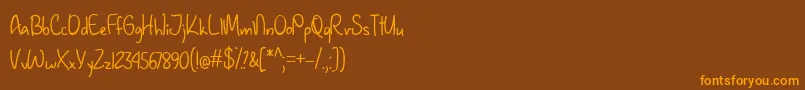 JanuaryHandwritingTtf-fontti – oranssit fontit ruskealla taustalla