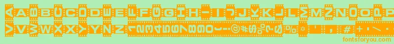 フォントVedetteNoire – オレンジの文字が緑の背景にあります。