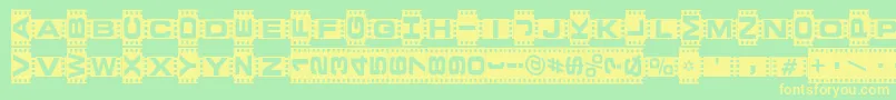 フォントVedetteNoire – 黄色の文字が緑の背景にあります