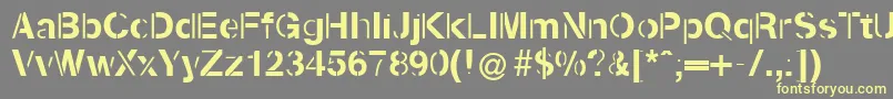 Kenzotiqua Font – Yellow Fonts on Gray Background