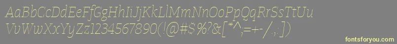Czcionka TangerserifnarrowulUltralightitalic – żółte czcionki na szarym tle
