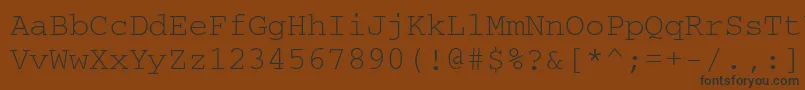 フォントCourierisoctt – 黒い文字が茶色の背景にあります