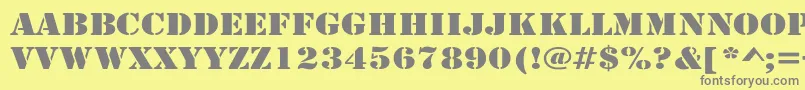 ArmyWide-fontti – harmaat kirjasimet keltaisella taustalla